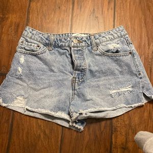 low waisted light blue jean shorts